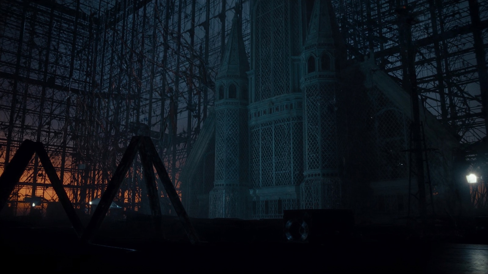 Elaborate themed architectural facade under construction with scenic framework and scaffolding